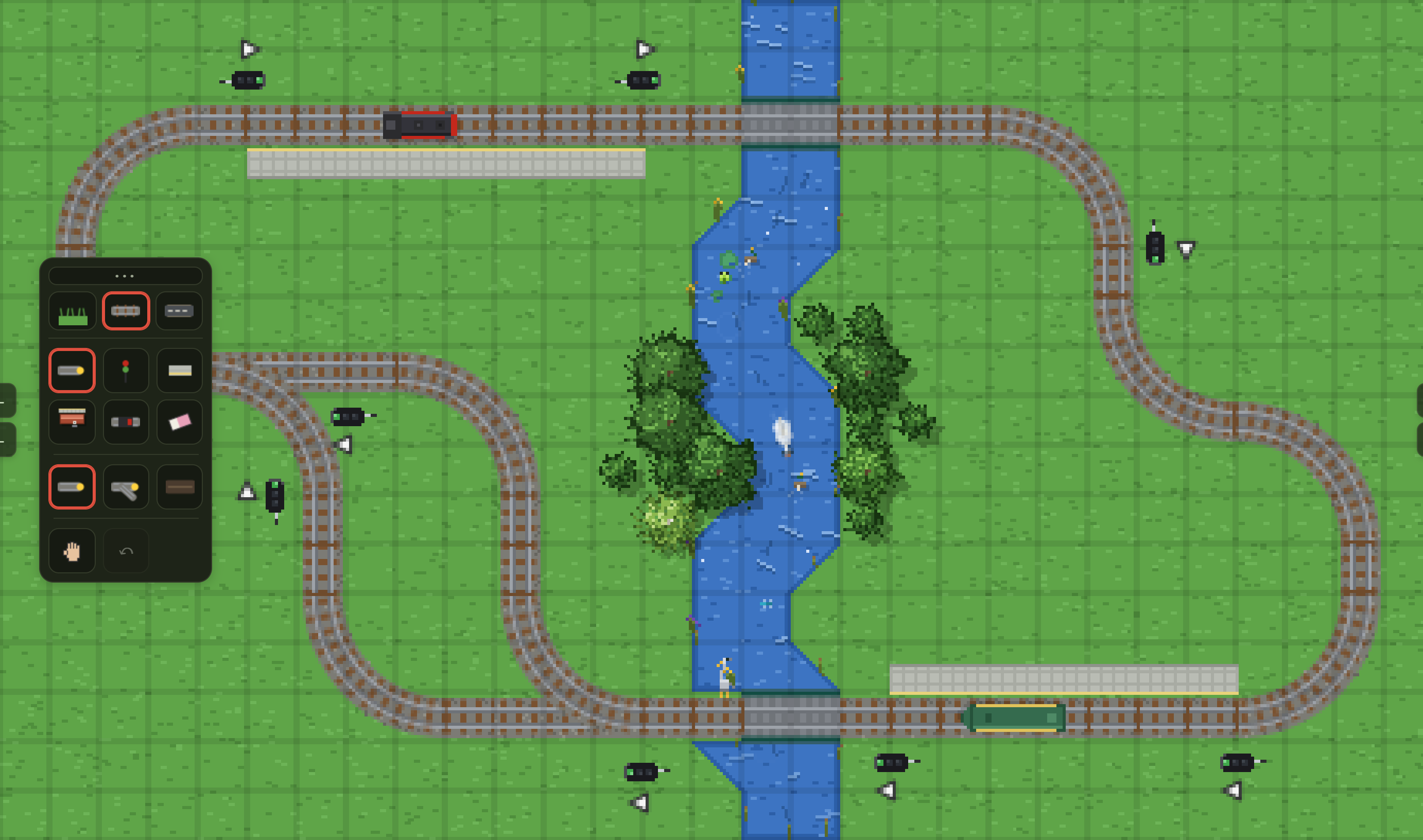 The same circuit in edit mode: a grid overlays the grass, the tool palette sits on the left, and ghost markers show where pieces would go.
